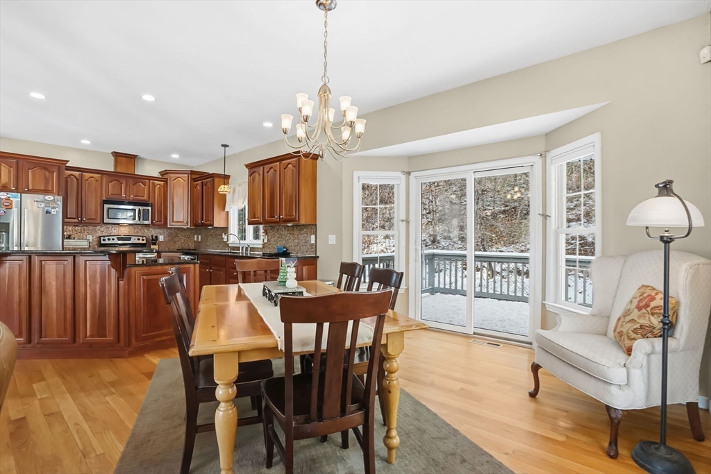 1 Pioneer Drive Palmer, MA 01069 - Photo 10 of 31 a view of a dining room with furniture a chandelier and wooden floor