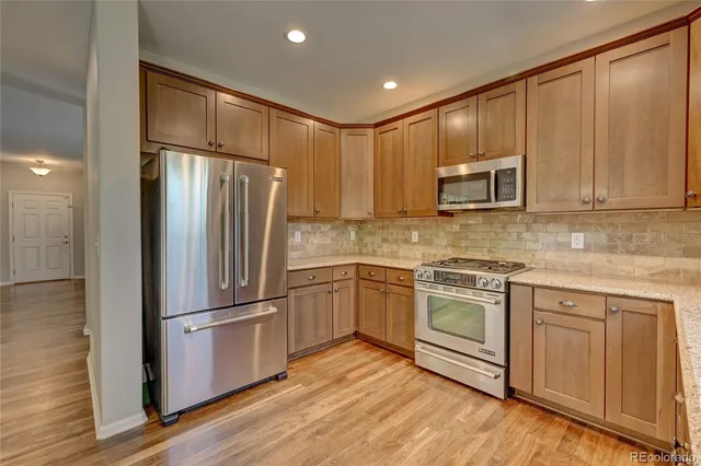 a spacious bathroom with a sink double vanity granite and a granite counter top