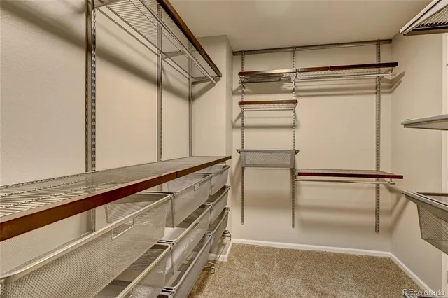 a view of hallway with wooden floor