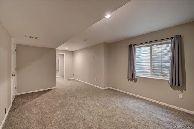 a view of a hallway with a room