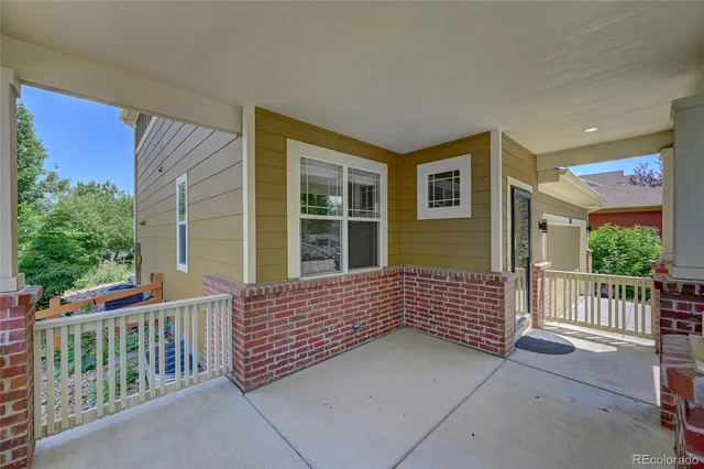 a view of a house with porch and wooden floor