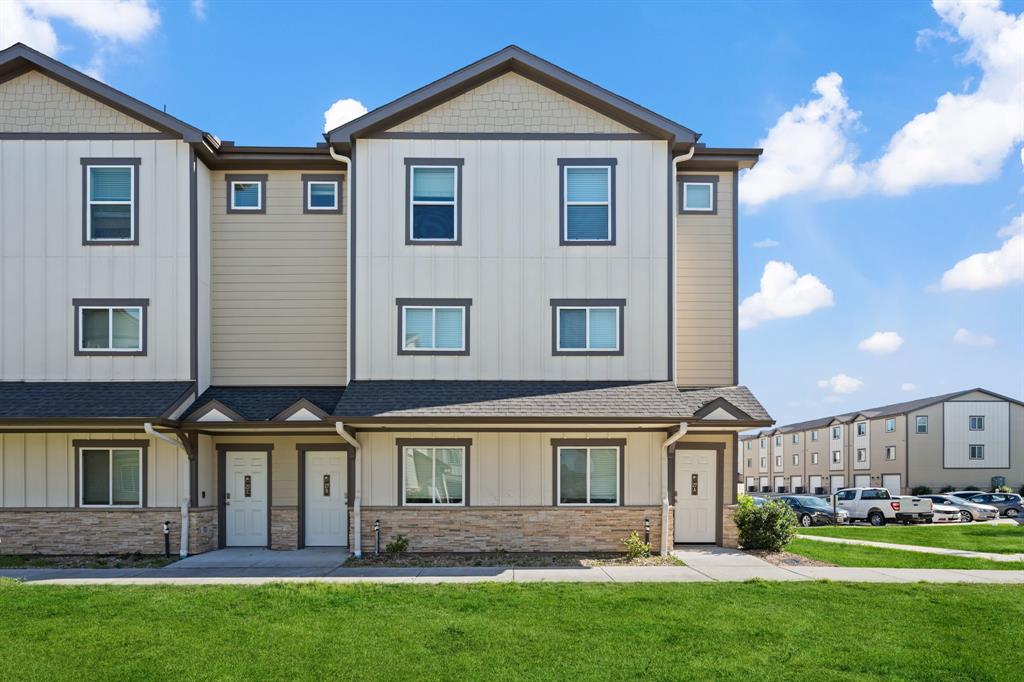 12603 Telge Road, Unit 27B Cypress, TX 77429 - Photo 1 of 26 a front view of a house with a yard