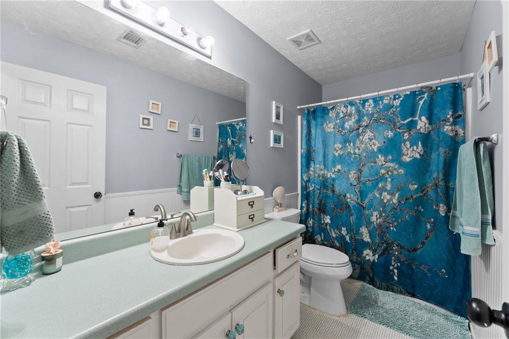 3615 South Bend Road Gainesville, GA 30506 - Photo 27 of 54 a bathroom with a sink toilet and shower