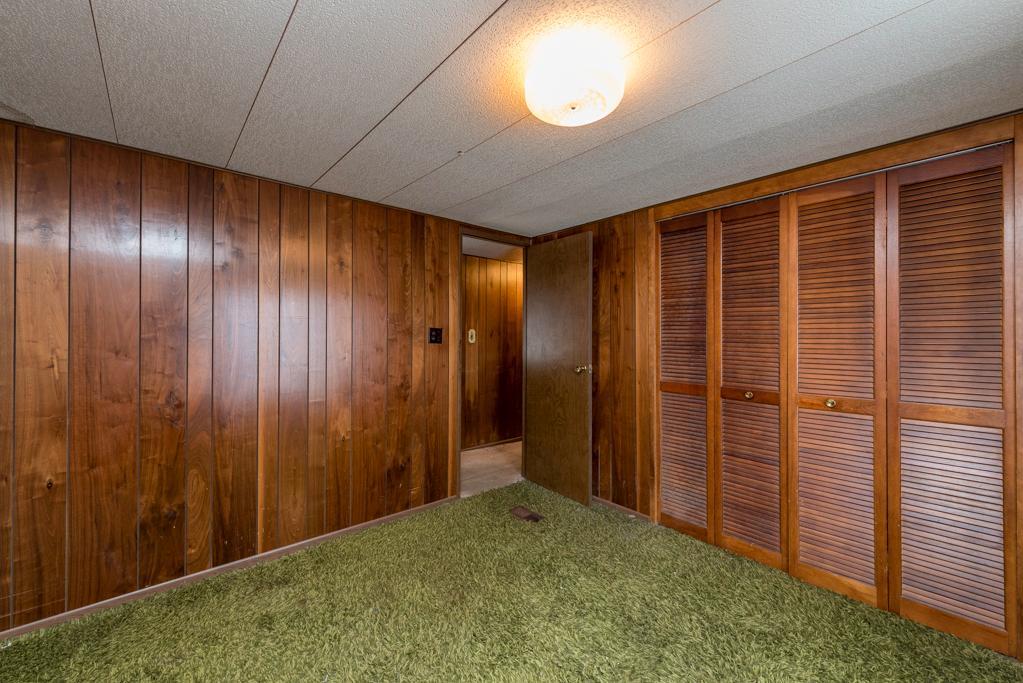 38285 North Sheridan Road, Unit 126 Beach Park, IL 60087 - Photo 12 of 17 an empty room with wooden floor and windows