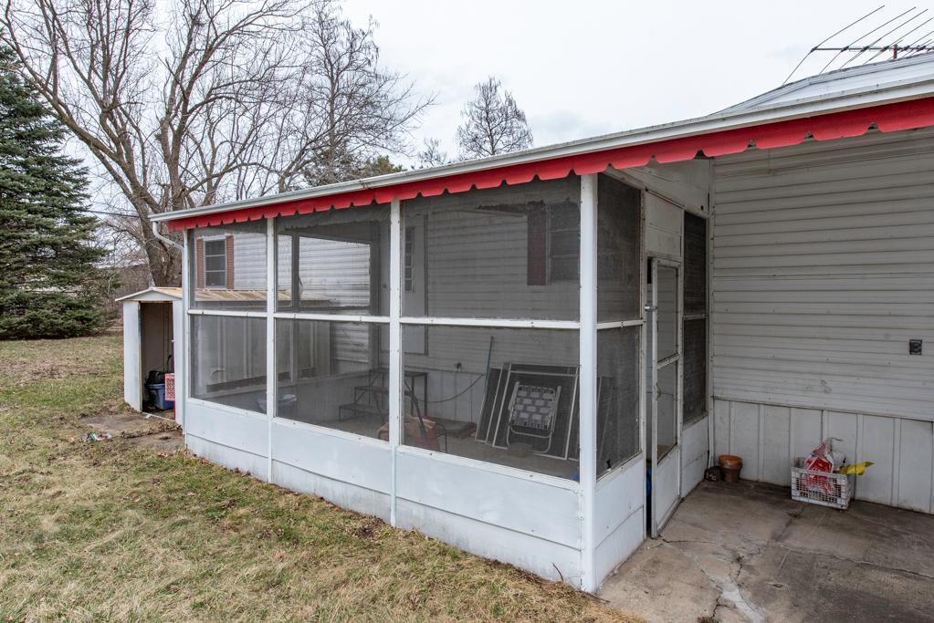 38285 North Sheridan Road, Unit 126 Beach Park, IL 60087 - Photo 14 of 17 a view of a house with a large window and wooden fence