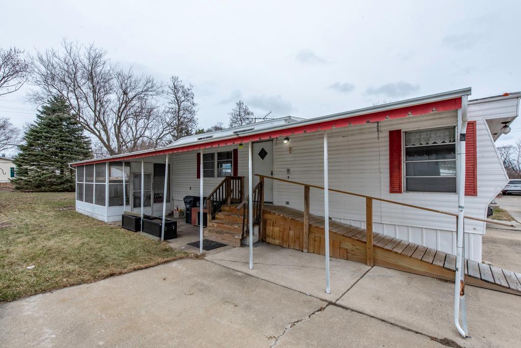 38285 North Sheridan Road, Unit 126 Beach Park, IL 60087 - Photo 2 of 17 a view of a house with a yard