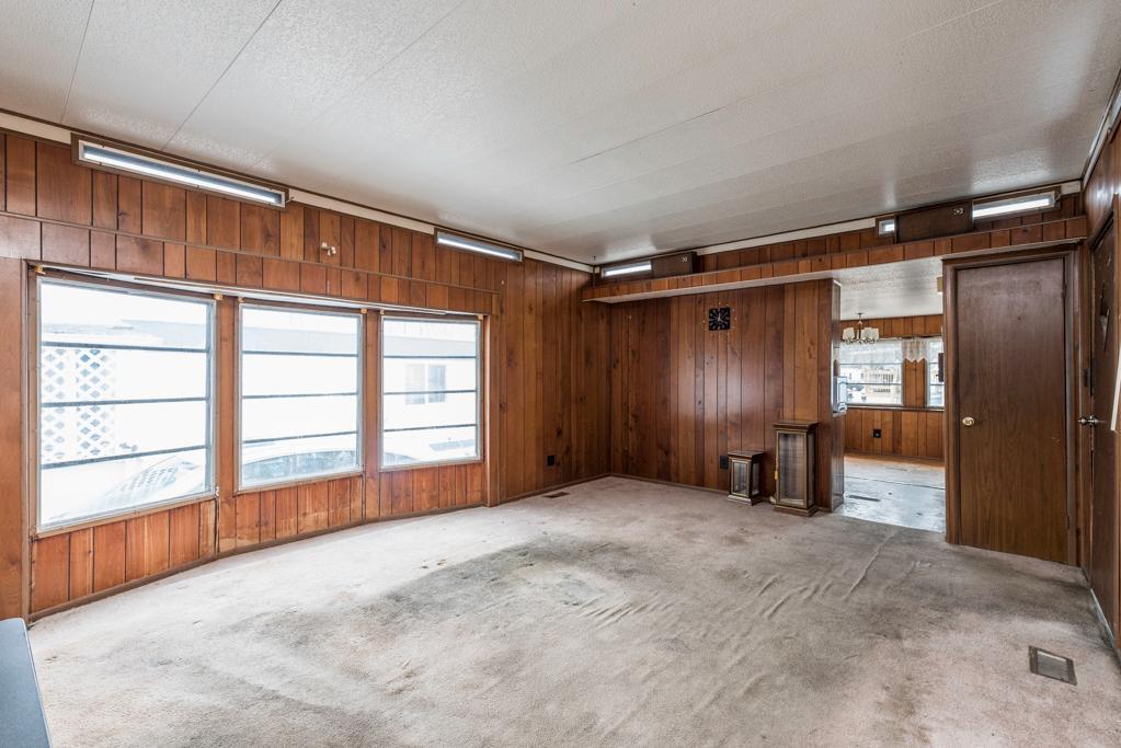 38285 North Sheridan Road, Unit 126 Beach Park, IL 60087 - Photo 5 of 17 en empty room with windows and wardrobe