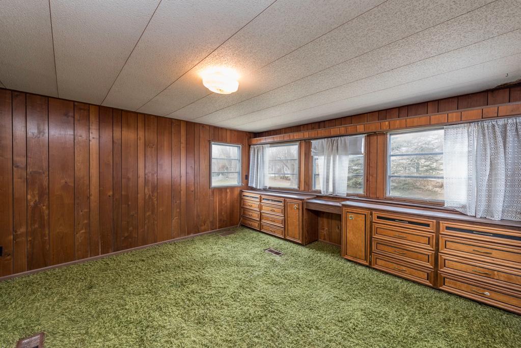 38285 North Sheridan Road, Unit 126 Beach Park, IL 60087 - Photo 9 of 17 a view of an empty room with window