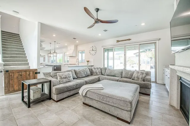 a kitchen with a cabinets and chandelier