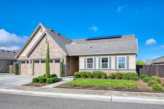 a view of front of house with a yard
