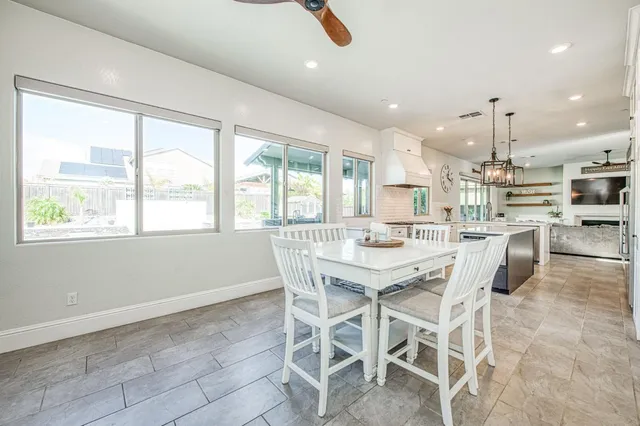a bathroom with a sink a toilet and a large mirror