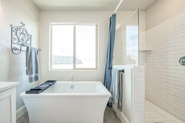 an aerial view of a house with a swimming pool