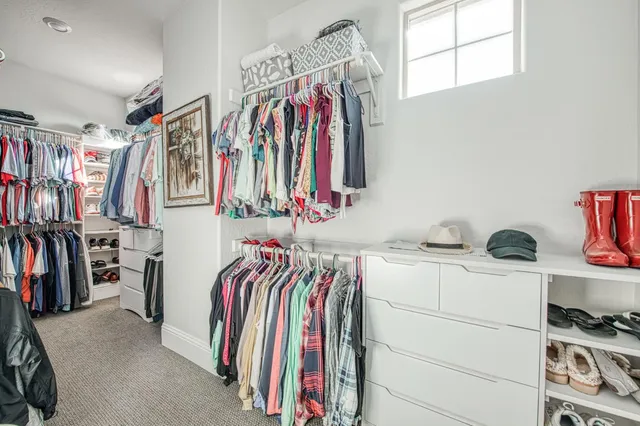 a aerial view of a house with swimming pool and outdoor seating