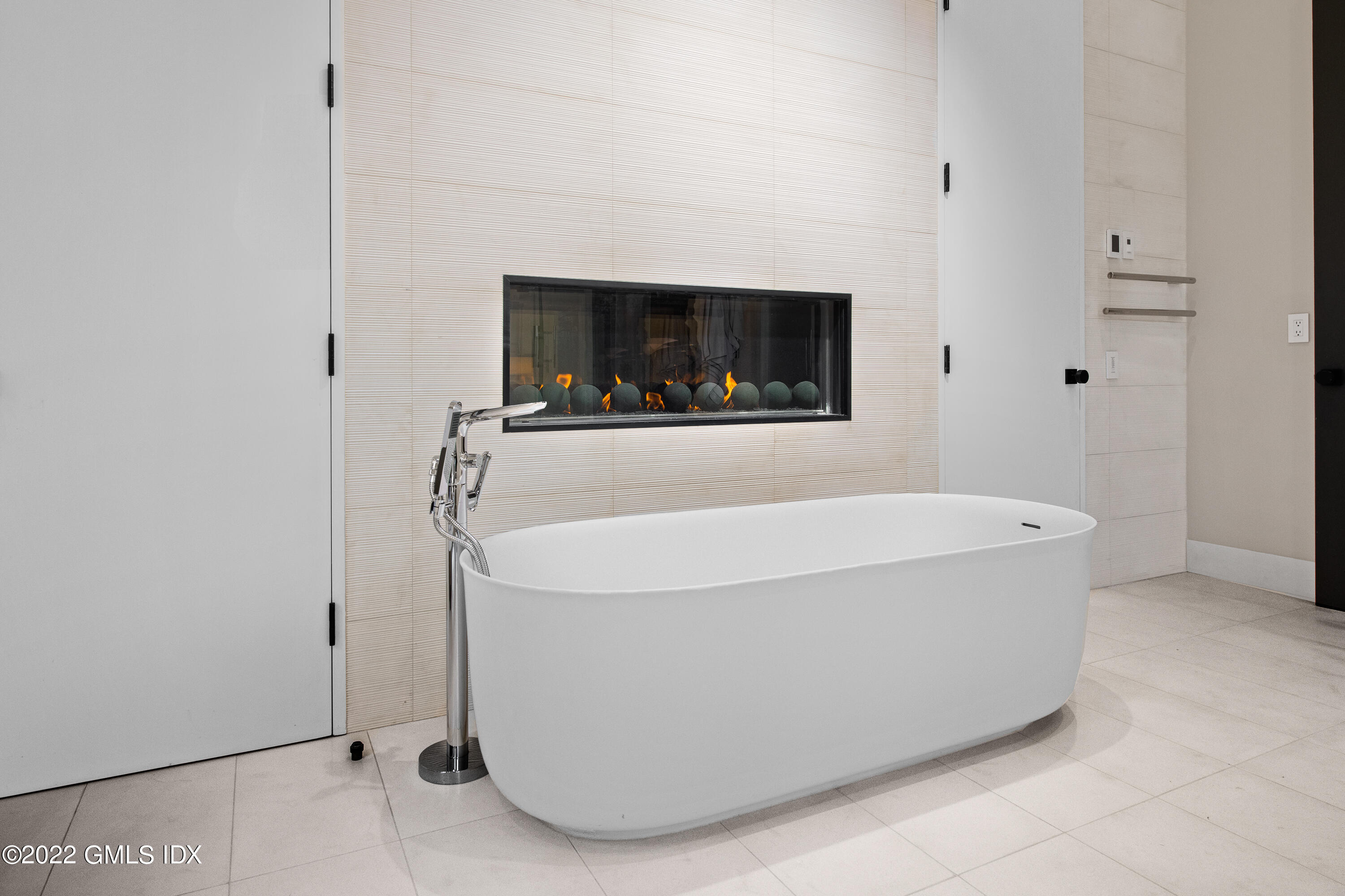 34 Beechcroft Road Greenwich, CT 06830 - Photo 20 of 25 a white bath tub sitting in a bathroom