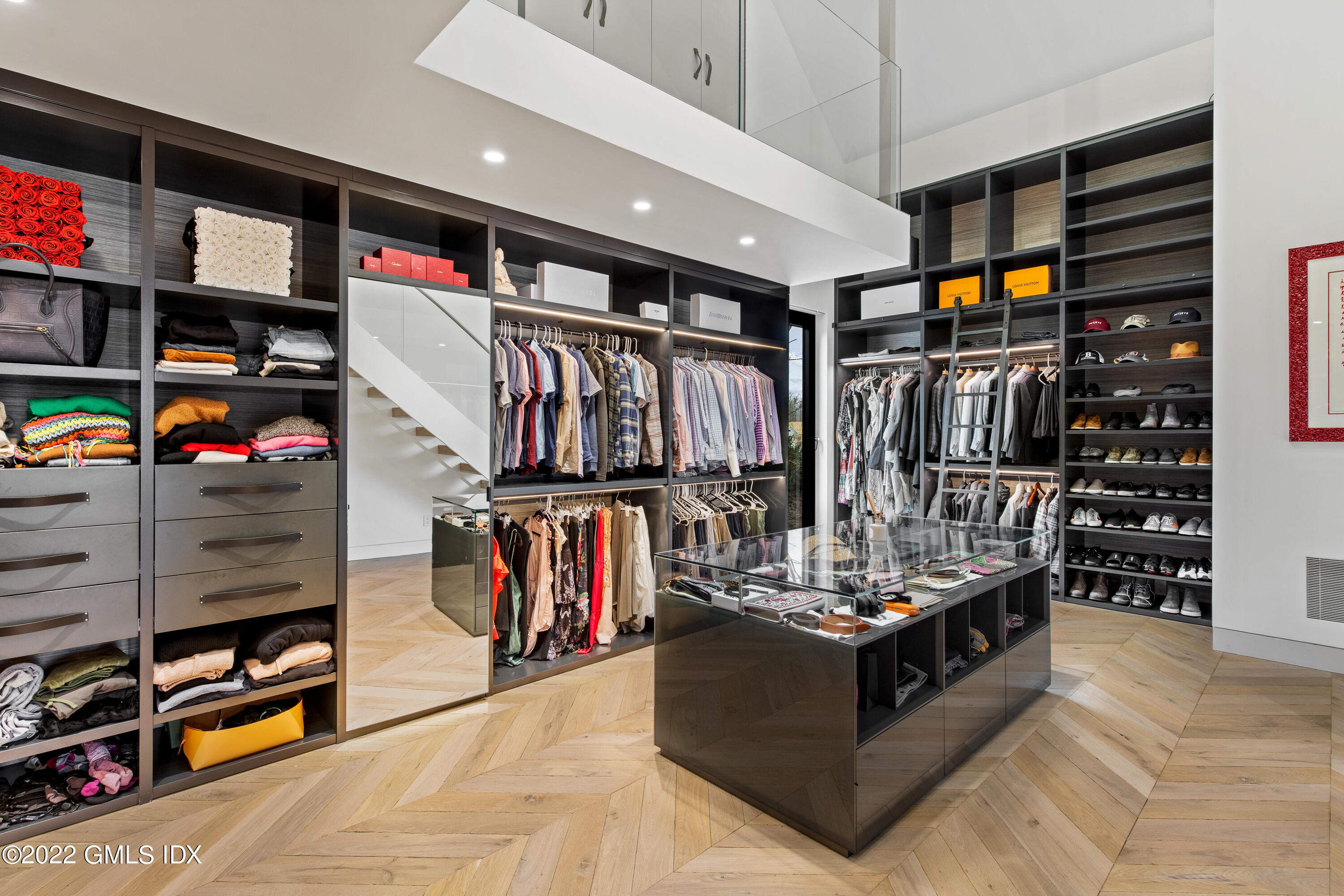 34 Beechcroft Road Greenwich, CT 06830 - Photo 21 of 25 a view of a living room with clothes and shoes