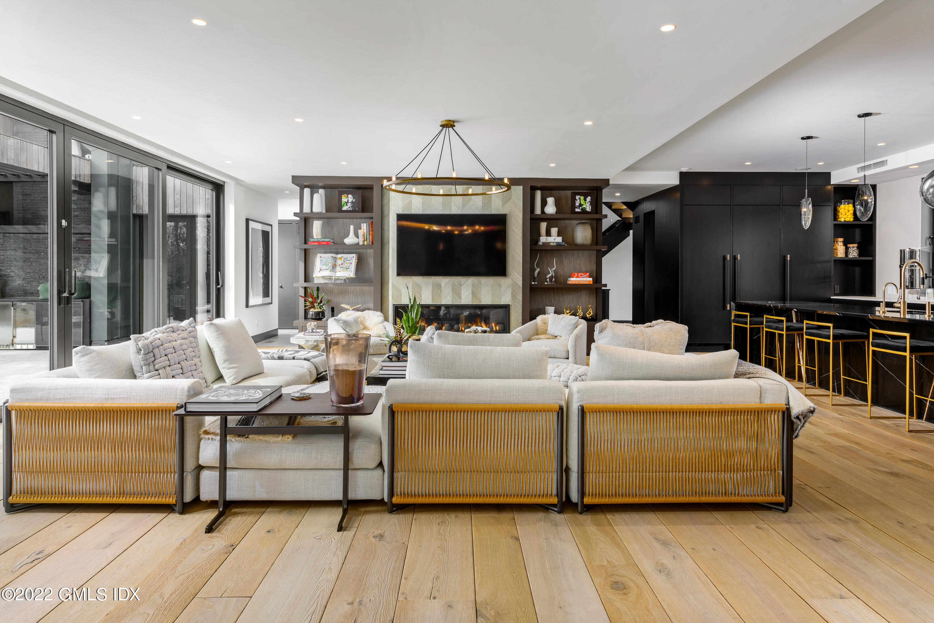 34 Beechcroft Road Greenwich, CT 06830 - Photo 9 of 25 a living room with furniture a flat screen tv and a wooden floor