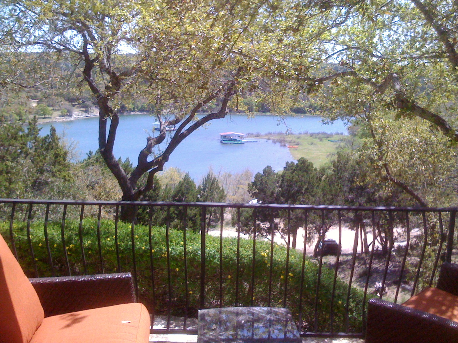 a view of a balcony with lake view and mountain view