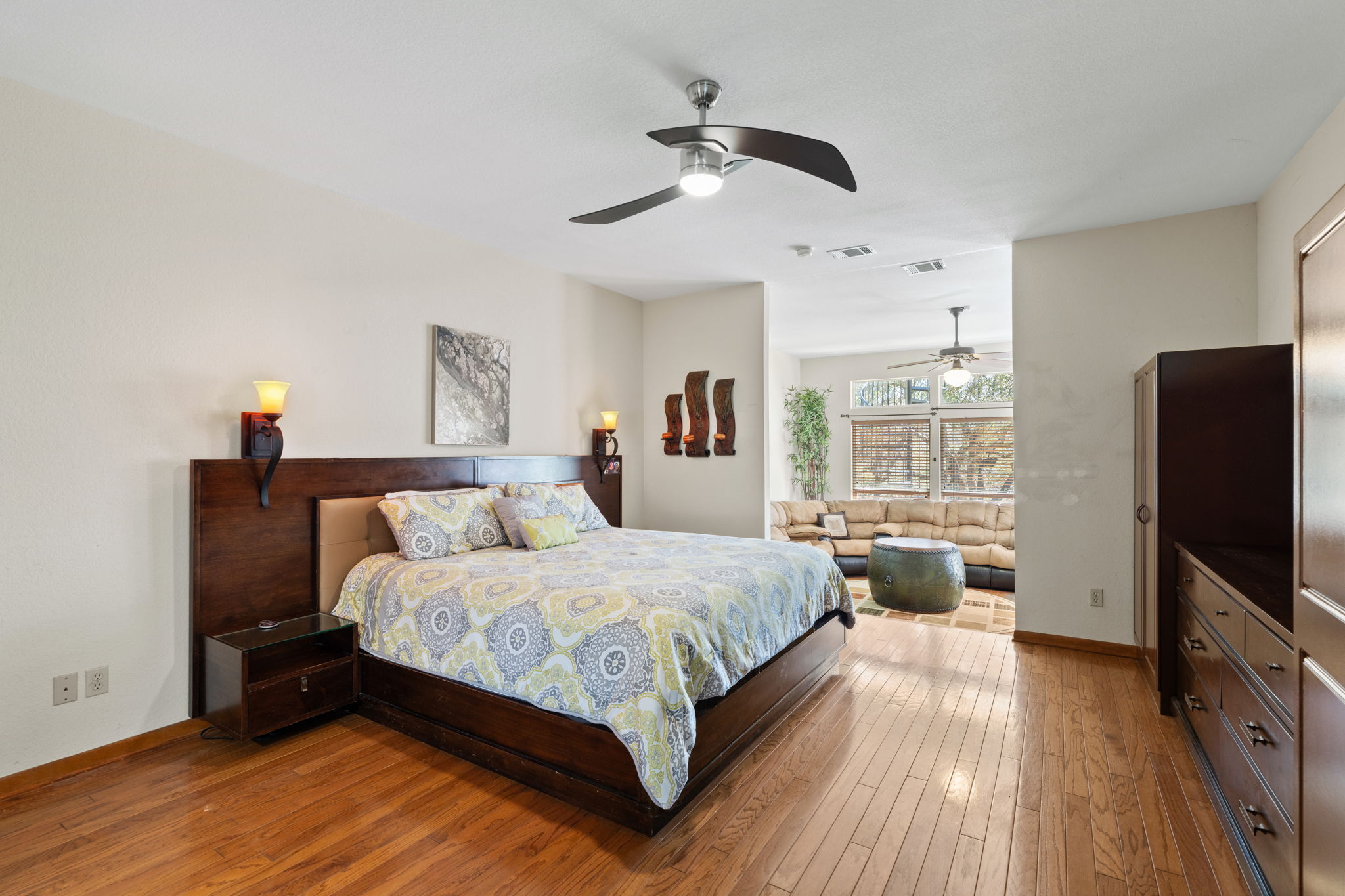 3405 Bee Creek Road Spicewood, TX 78669 - Photo 15 of 40 a bedroom with a bed and a flat screen tv