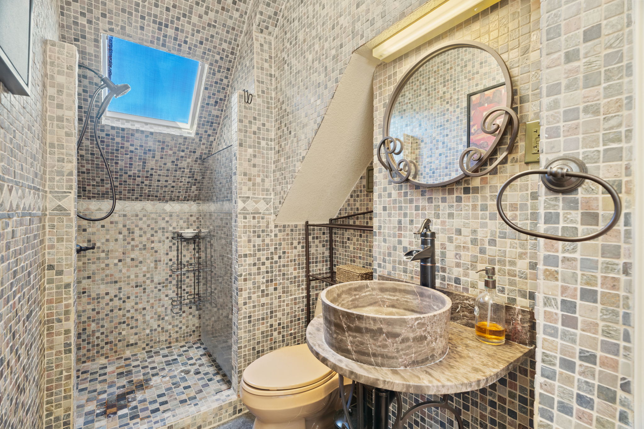 3405 Bee Creek Road Spicewood, TX 78669 - Photo 22 of 40 a bathroom with a toilet and a sink