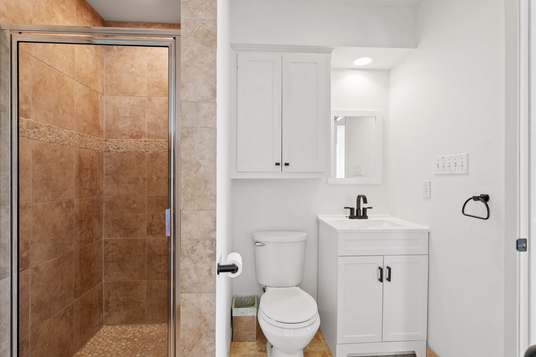 3405 Bee Creek Road Spicewood, TX 78669 - Photo 28 of 40 a bathroom with a sink a toilet and shower