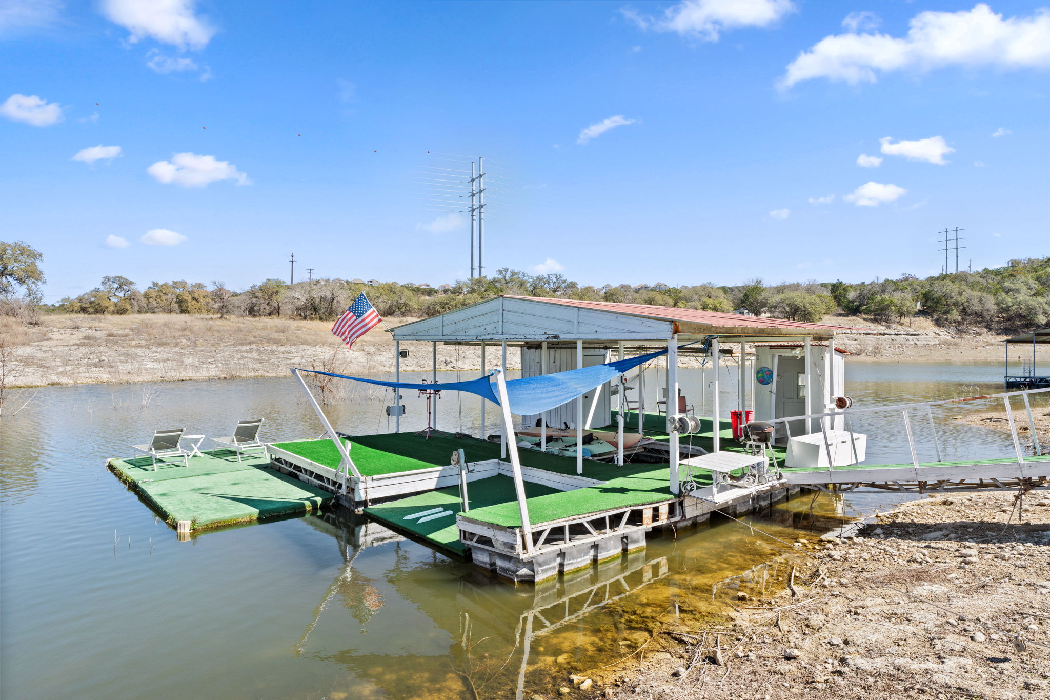 3405 Bee Creek Road Spicewood, TX 78669 - Photo 34 of 40 a view of a lake with a terrace