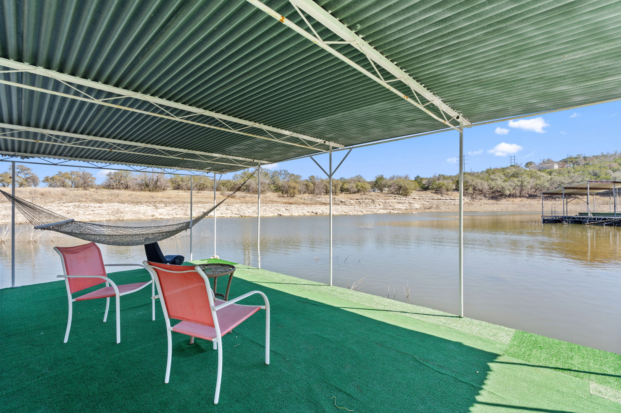 3405 Bee Creek Road Spicewood, TX 78669 - Photo 36 of 40 a backyard of a house with table and chairs