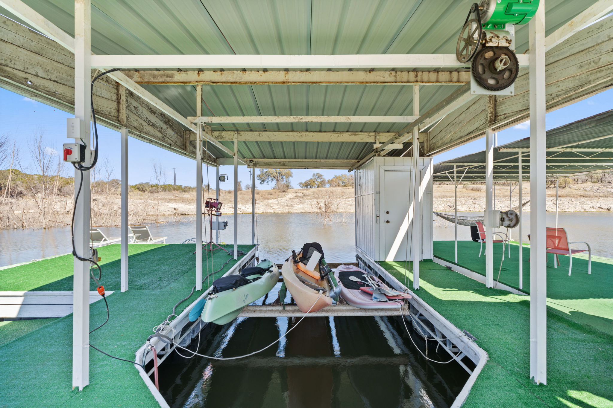 3405 Bee Creek Road Spicewood, TX 78669 - Photo 37 of 40 a front view of a house with garden