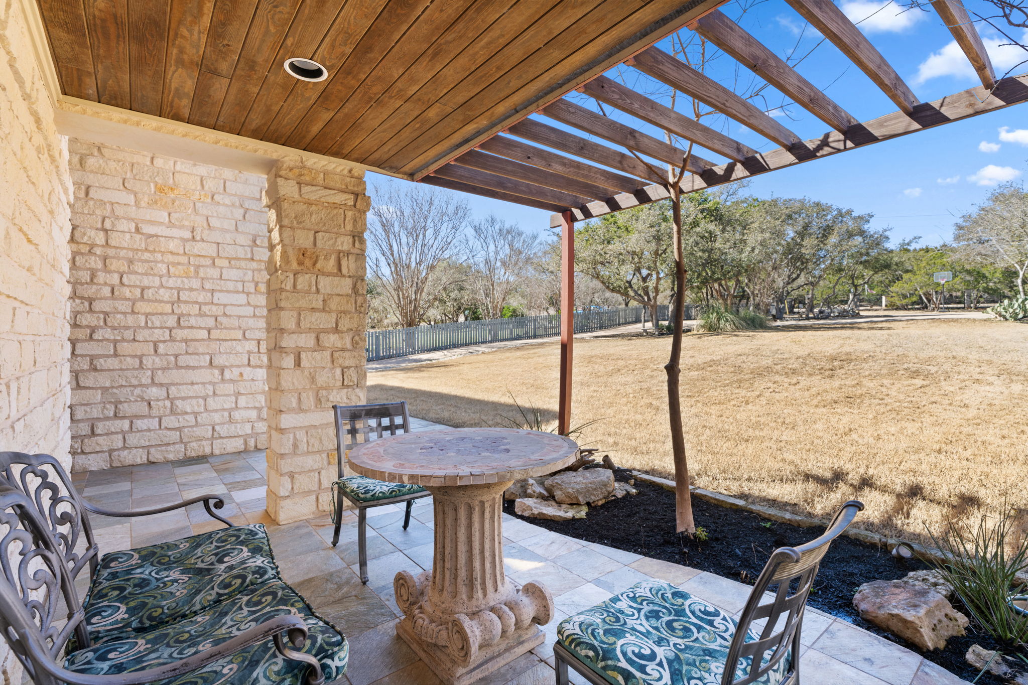 3405 Bee Creek Road Spicewood, TX 78669 - Photo 4 of 40 a outdoor living space with furniture and a rug
