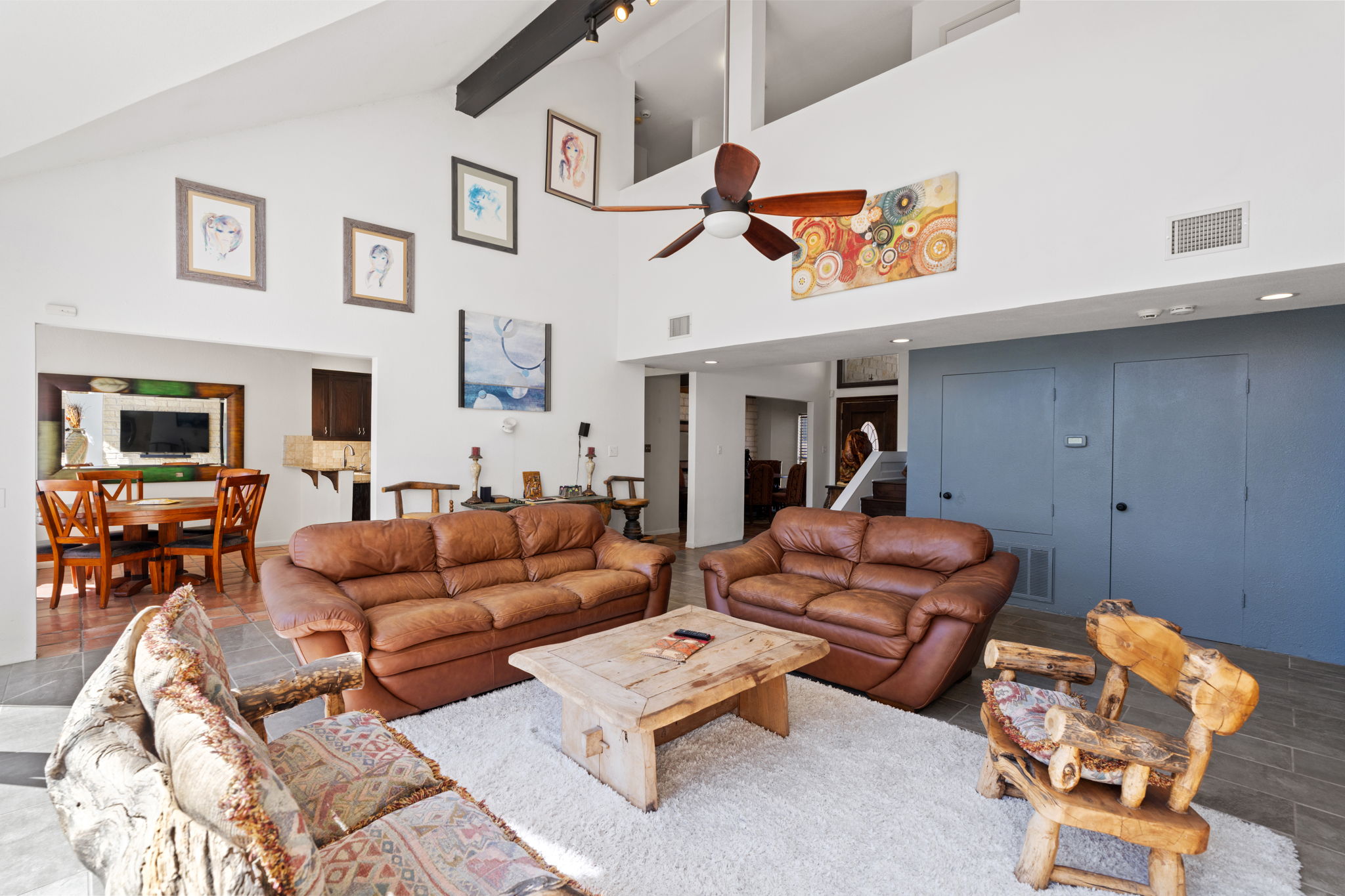 3405 Bee Creek Road Spicewood, TX 78669 - Photo 9 of 40 a living room with furniture and a flat screen tv