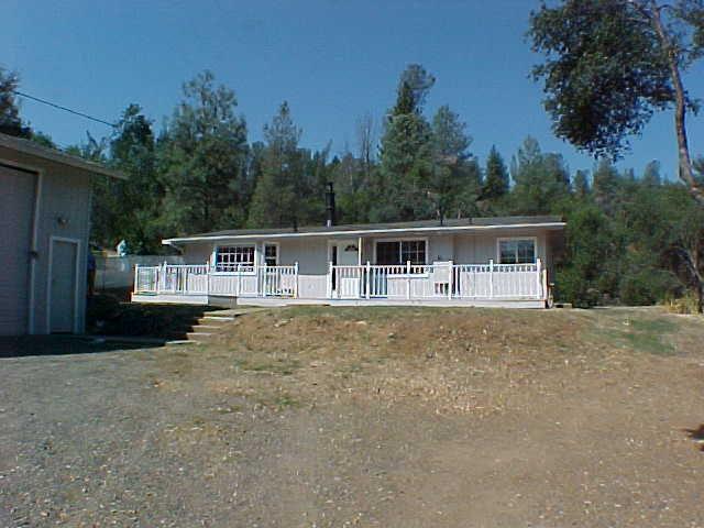 12828 Williamson Road Redding, CA 96003 - Photo 1 of 1 a house with trees in the background