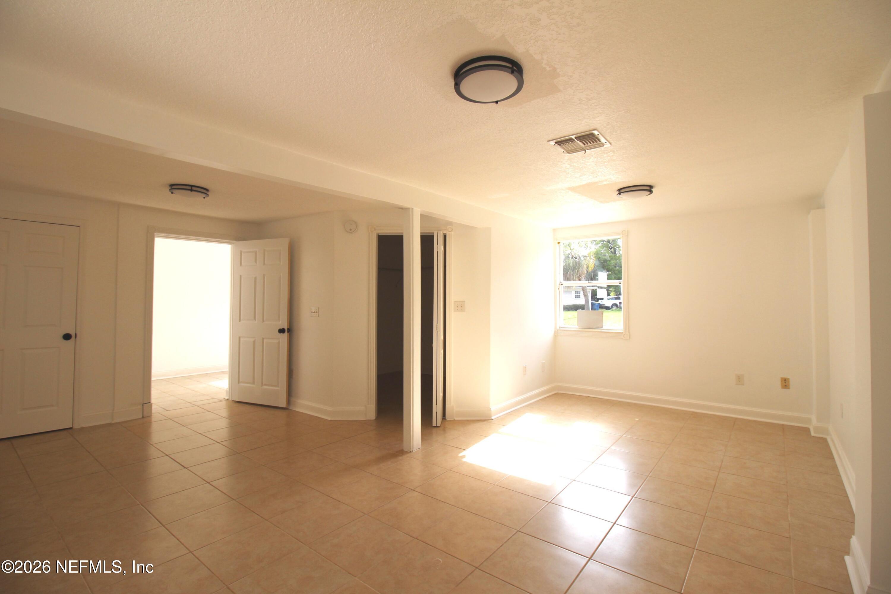 1304 King Arthur Road Jacksonville, FL 32211 - Photo 14 of 25 a view of a livingroom with wooden floor