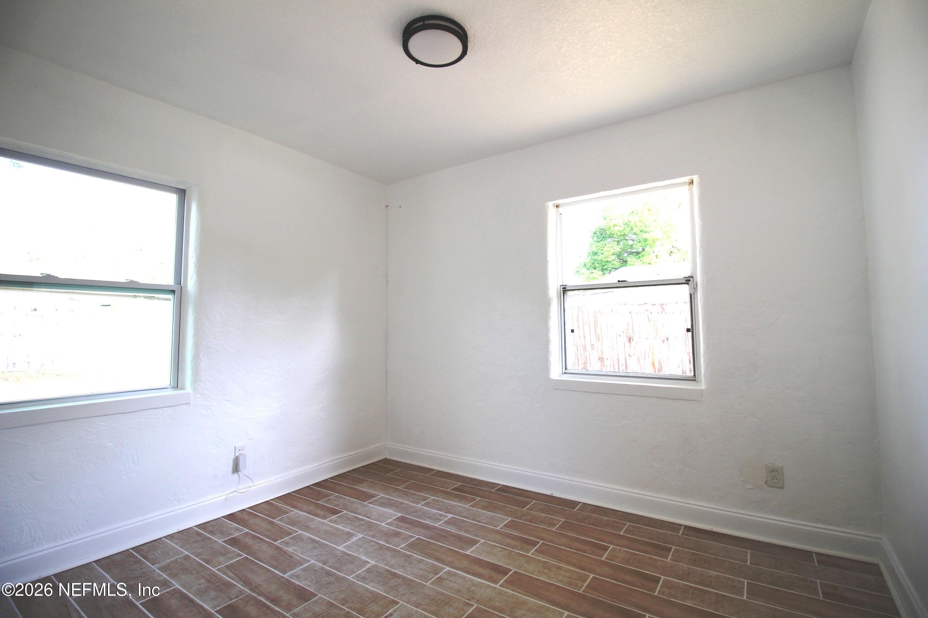 1304 King Arthur Road Jacksonville, FL 32211 - Photo 19 of 25 an empty room with a window
