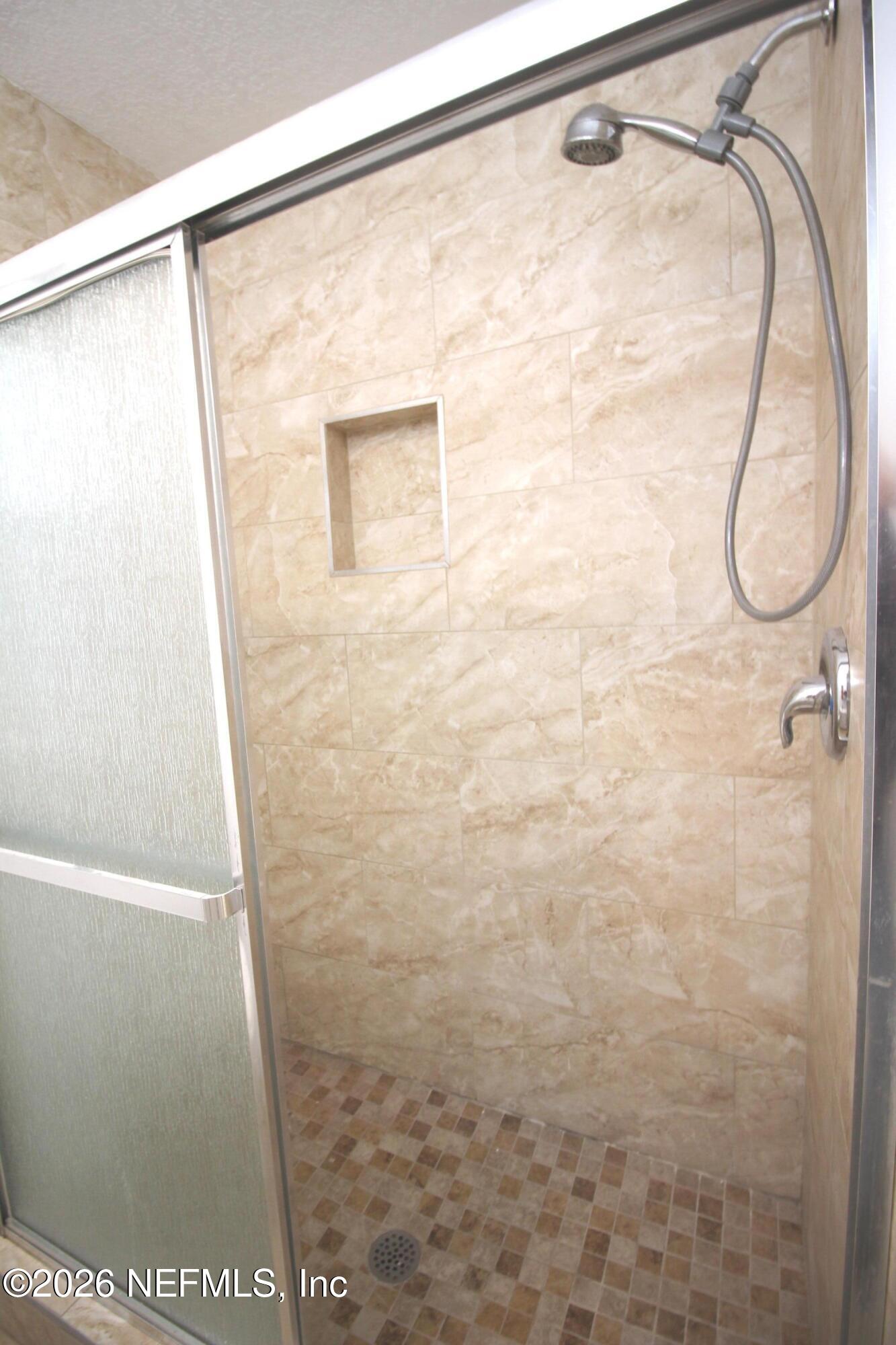 1304 King Arthur Road Jacksonville, FL 32211 - Photo 22 of 25 a bathroom with a shower
