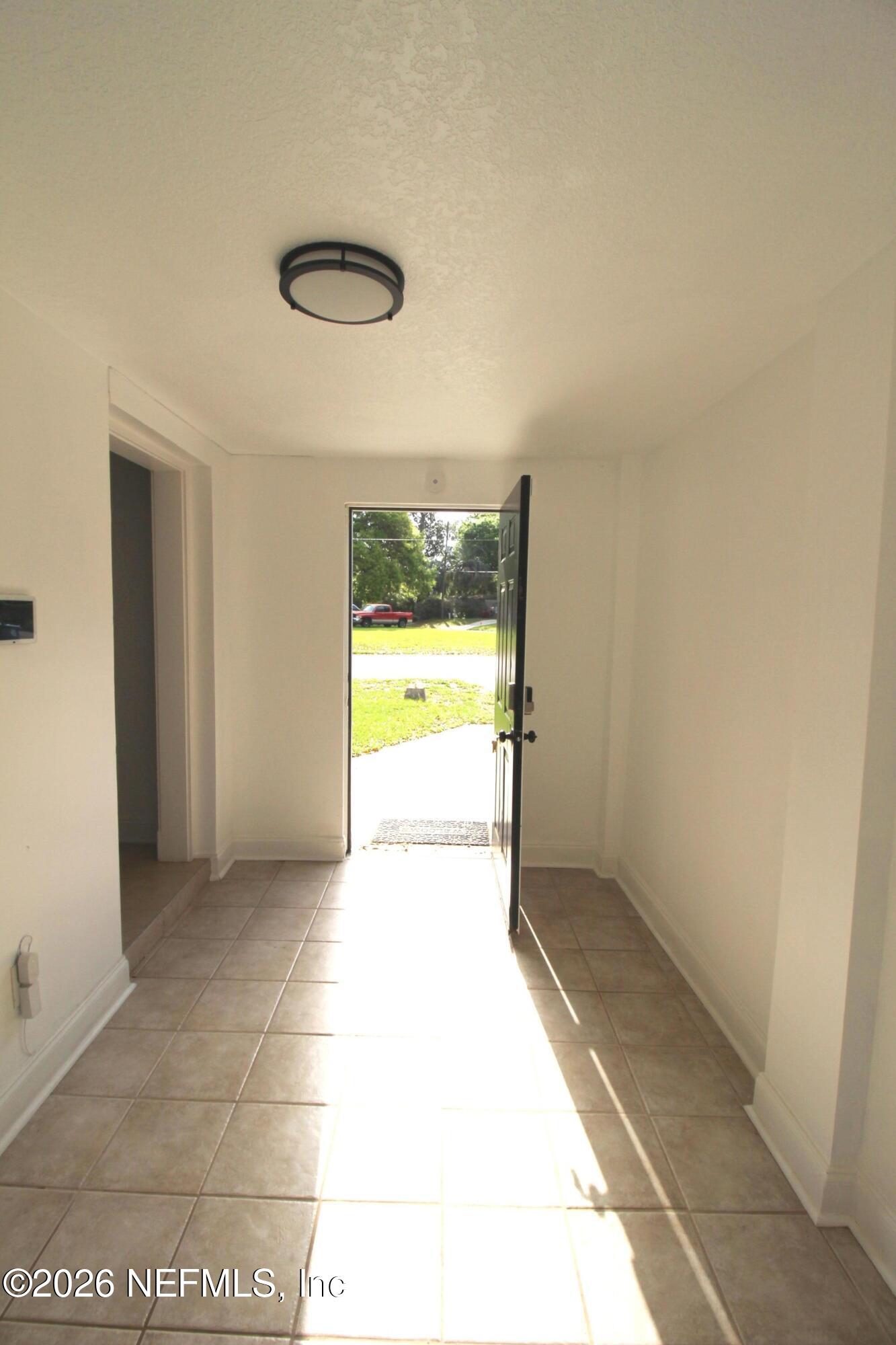 1304 King Arthur Road Jacksonville, FL 32211 - Photo 23 of 25 a view of an empty room and a window