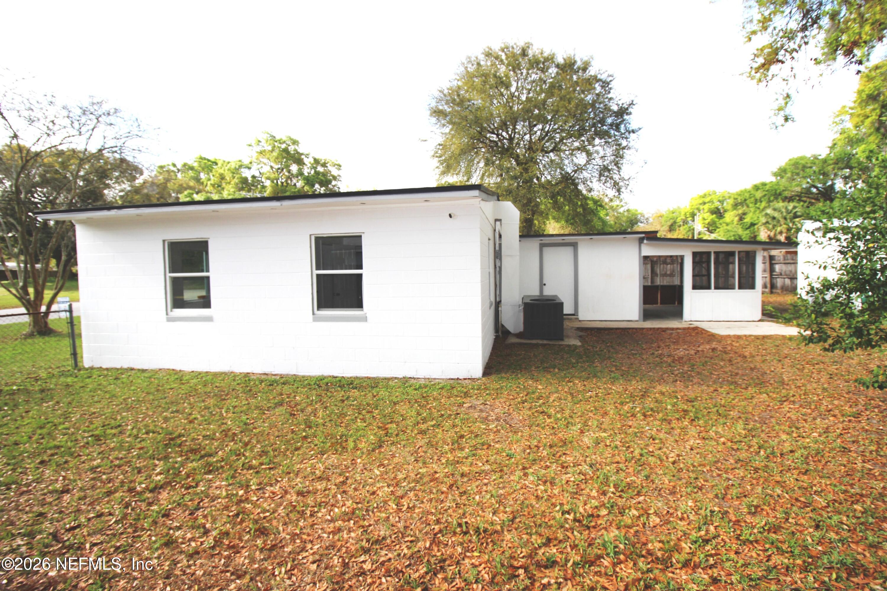 1304 King Arthur Road Jacksonville, FL 32211 - Photo 4 of 25 a view of a backyard of the house