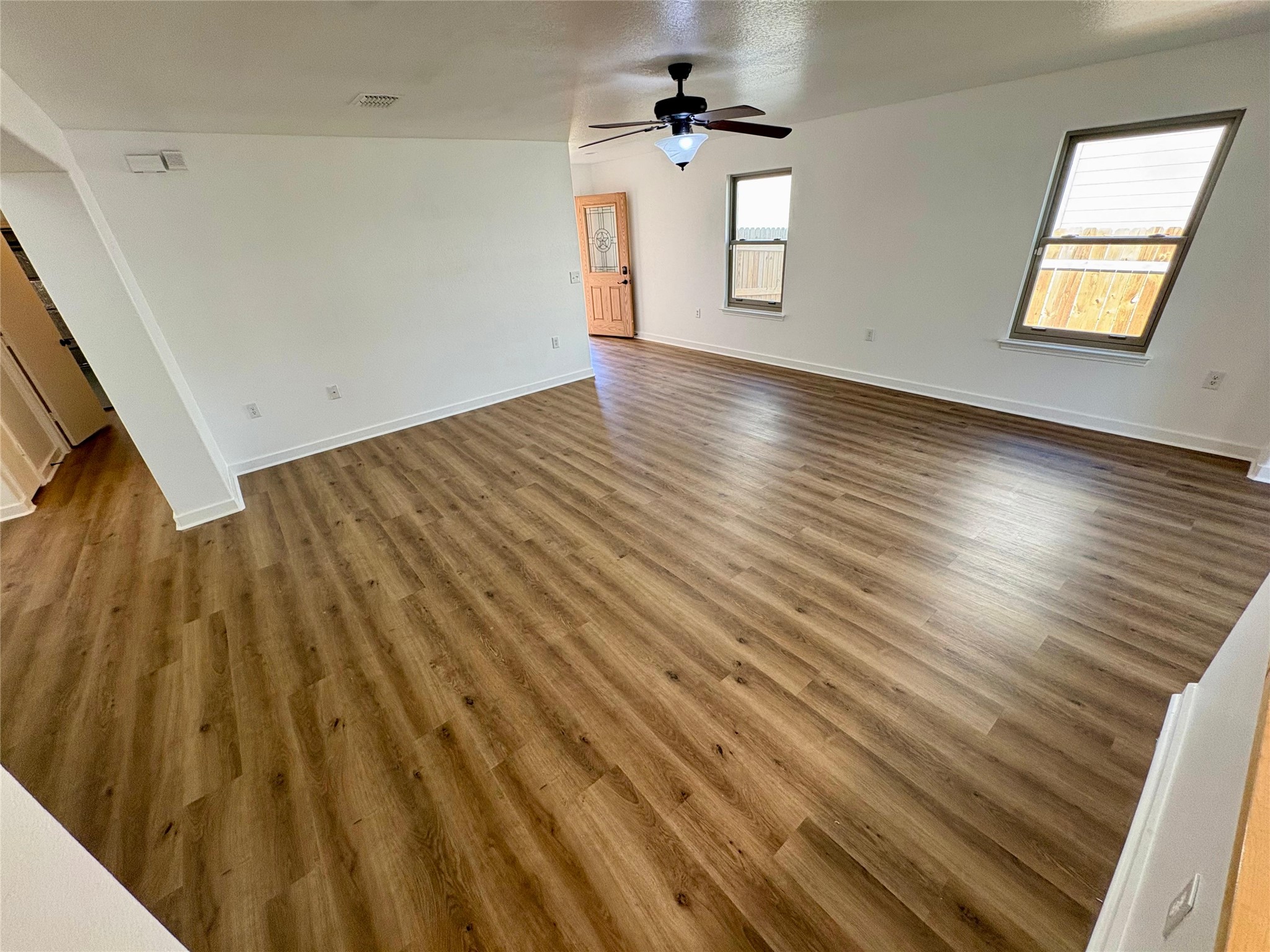 8003 Bannock Lane Austin, TX 78747 - Photo 8 of 40 Living room with dark wood-style flooring and ceiling fan