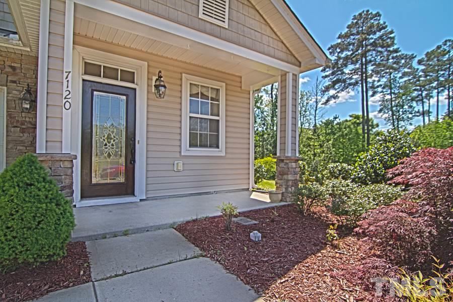 7120 Lowell Ridge Road Raleigh, NC 27616 - Photo 2 of 19 a view of front door of house with outdoor space