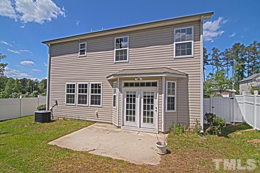 7120 Lowell Ridge Road Raleigh, NC 27616 - Photo 18 of 19 a front view of a house with garden