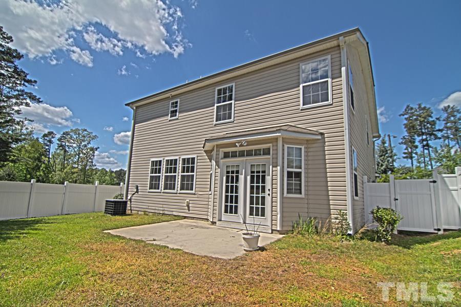 7120 Lowell Ridge Road Raleigh, NC 27616 - Photo 19 of 19 a front view of a house with a yard