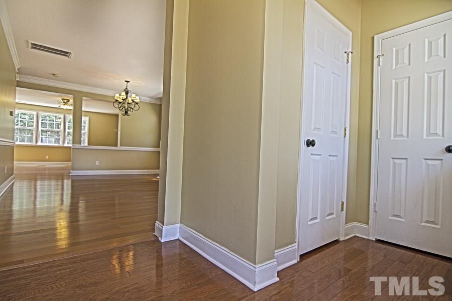7120 Lowell Ridge Road Raleigh, NC 27616 - Photo 3 of 19 a view of a livingroom with wooden floor