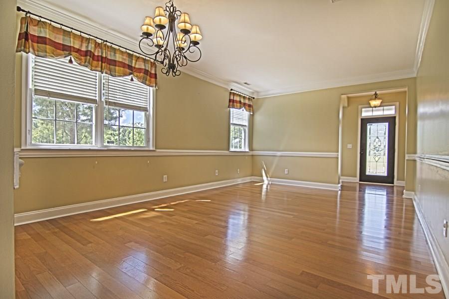7120 Lowell Ridge Road Raleigh, NC 27616 - Photo 5 of 19 a view of an empty room with wooden floor and a window