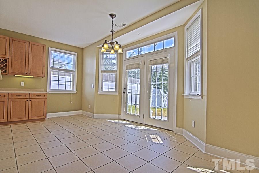 7120 Lowell Ridge Road Raleigh, NC 27616 - Photo 8 of 19 a view of an empty room with window and chandelier