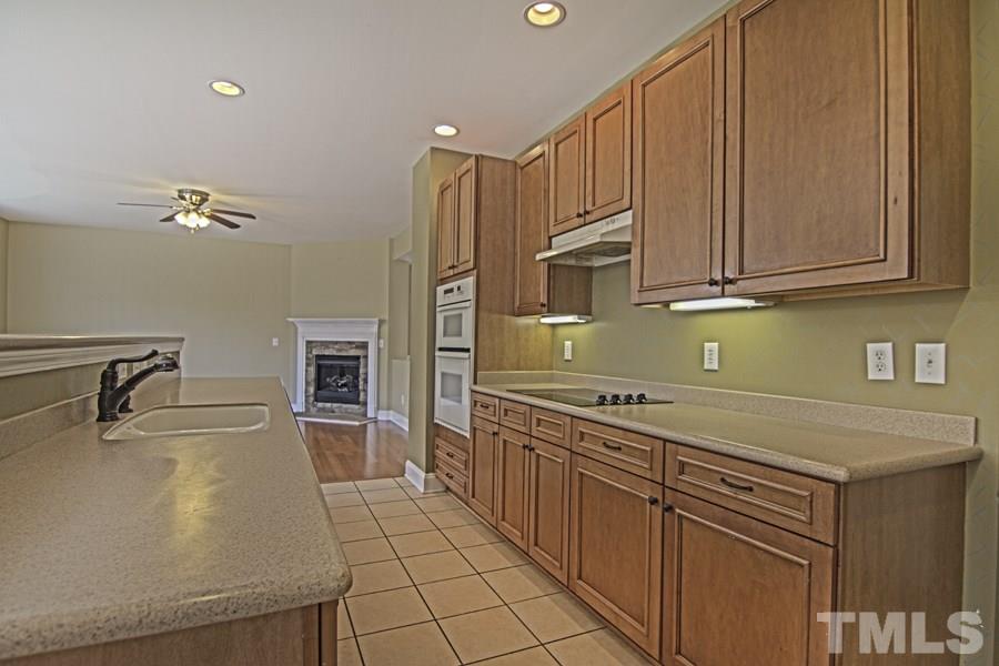 7120 Lowell Ridge Road Raleigh, NC 27616 - Photo 9 of 19 a kitchen with stainless steel appliances granite countertop a sink and cabinets