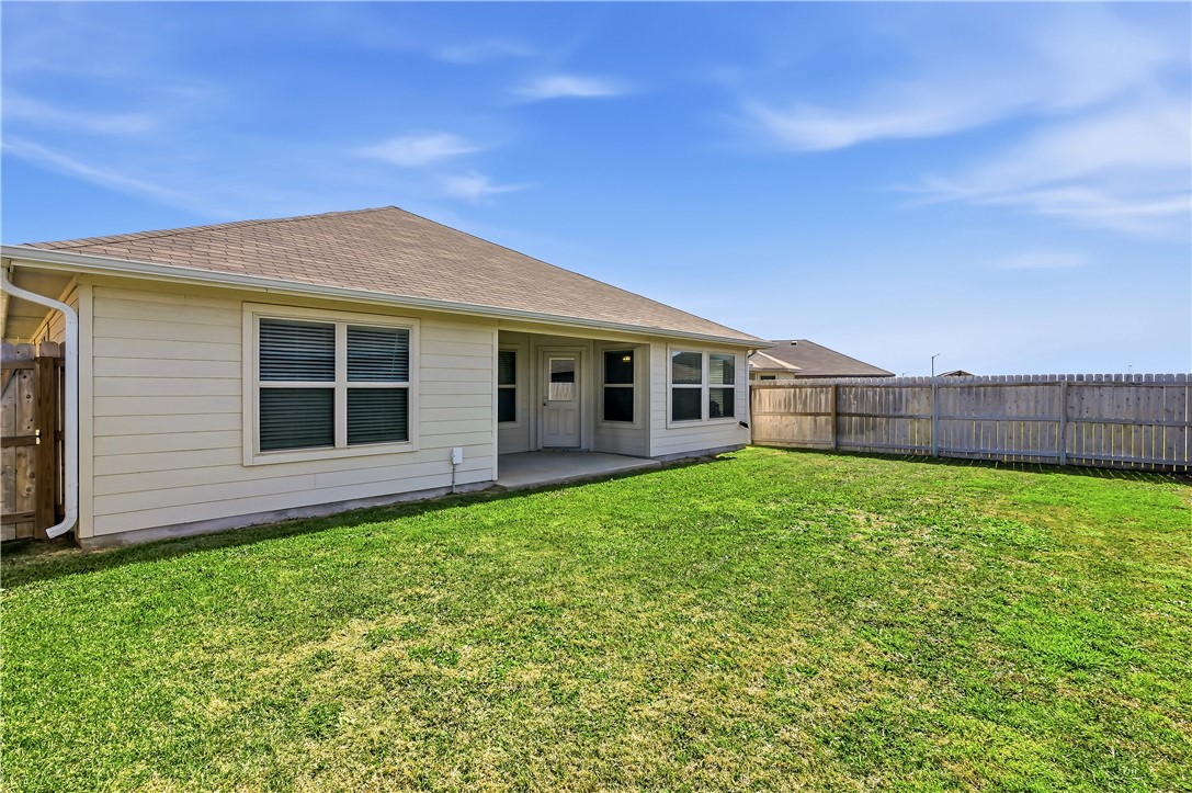 2009 Chief Street Bryan, TX 77807 - Photo 26 of 27 a view of a house with a backyard