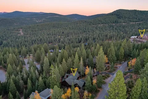 a view of a town with mountains in the background