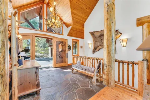 a view of living room kitchen and deck