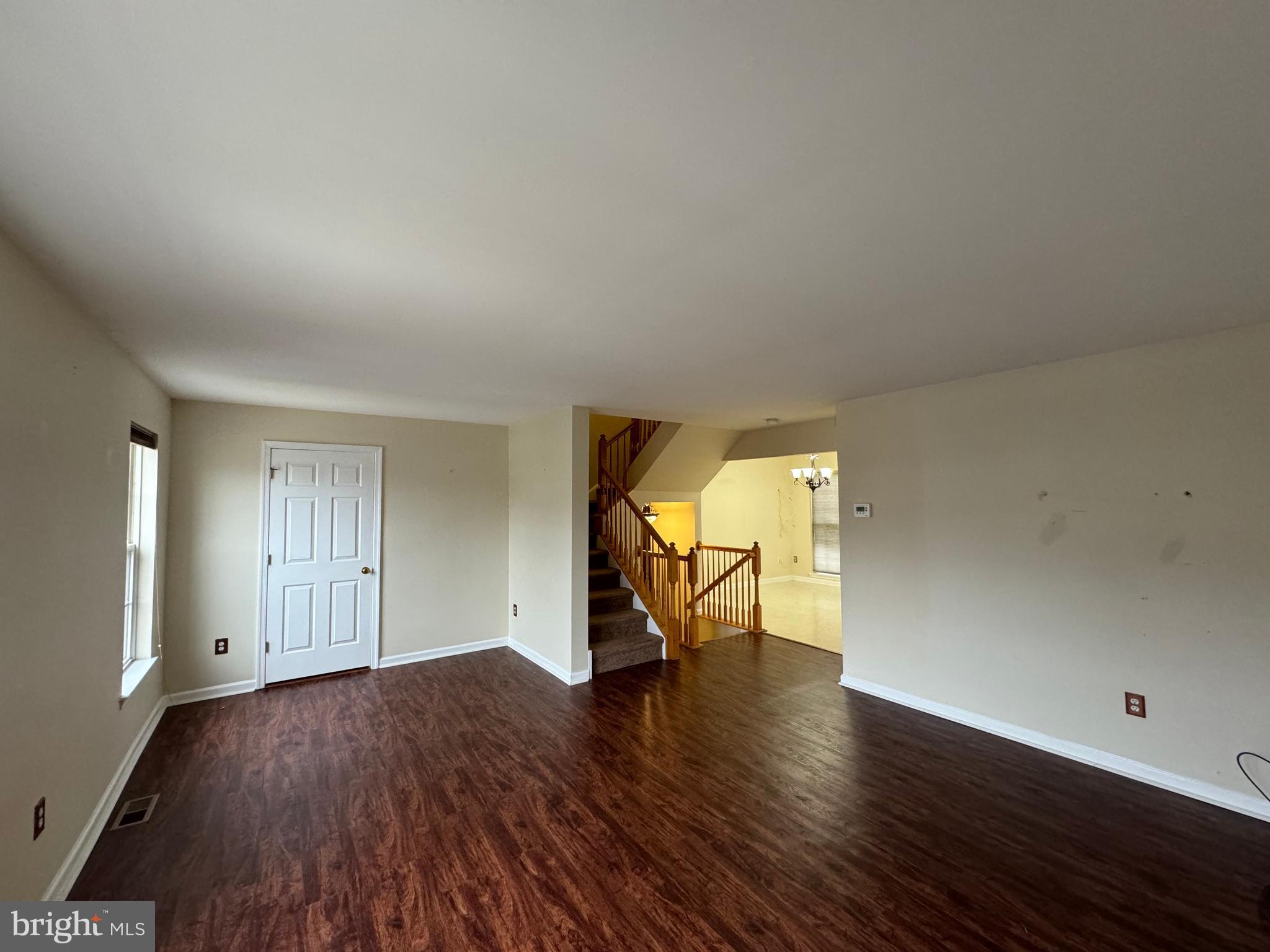 1002 Carlisle Road Egg Harbor Township, NJ 08234 - Photo 13 of 32 an empty room with wooden floor and a window