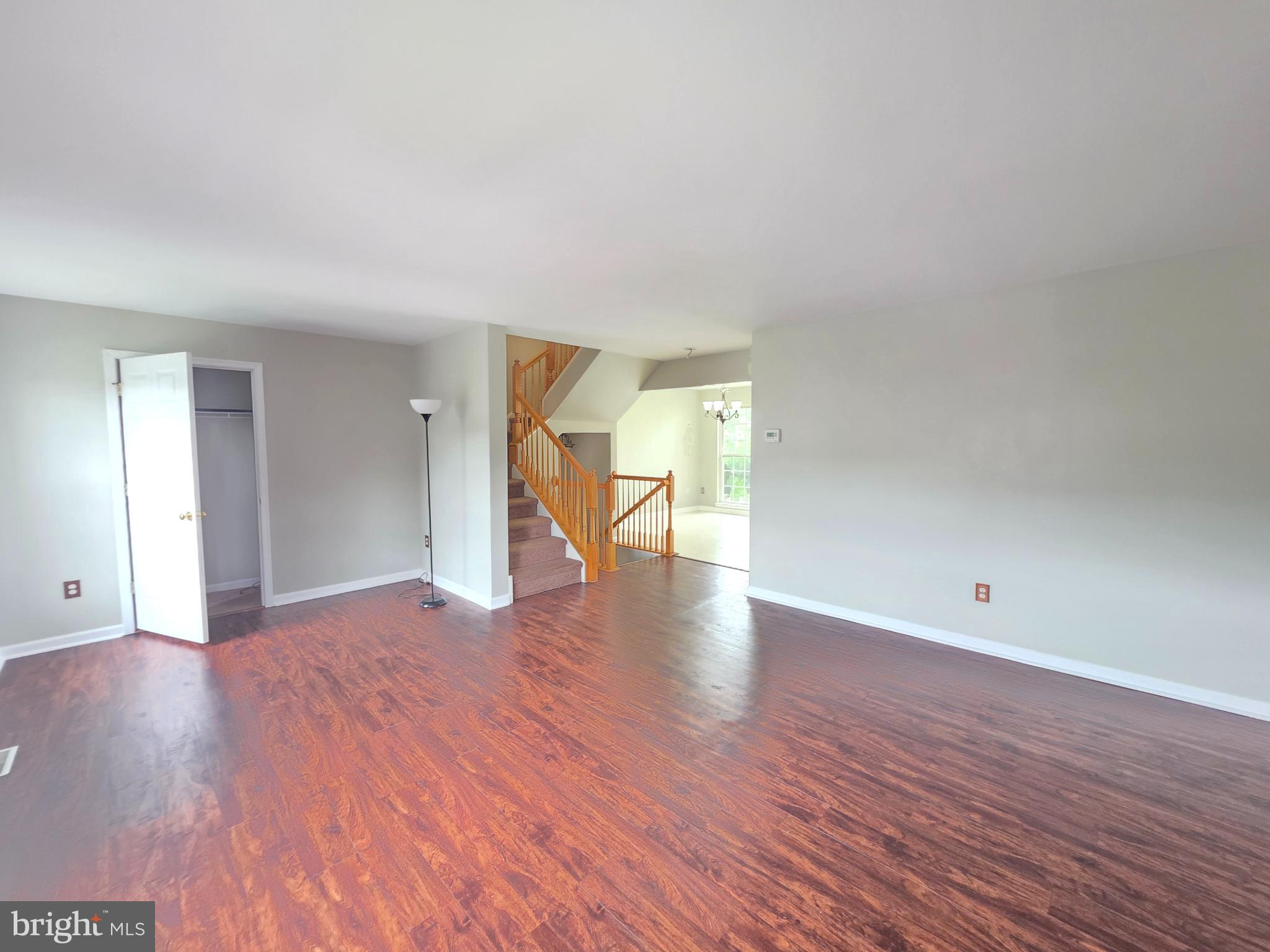 1002 Carlisle Road Egg Harbor Township, NJ 08234 - Photo 22 of 32 a view of an empty room with wooden floor and a window