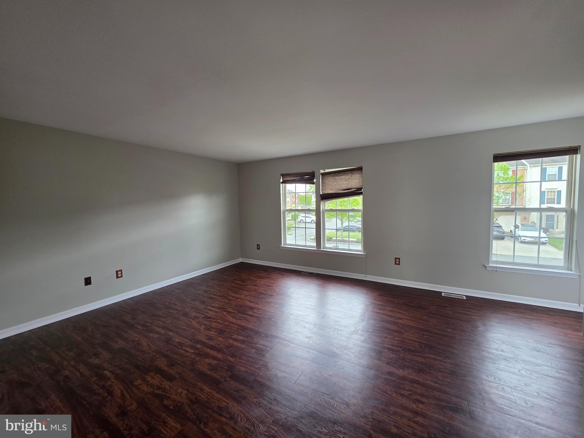 1002 Carlisle Road Egg Harbor Township, NJ 08234 - Photo 23 of 32 an empty room with wooden floor and window