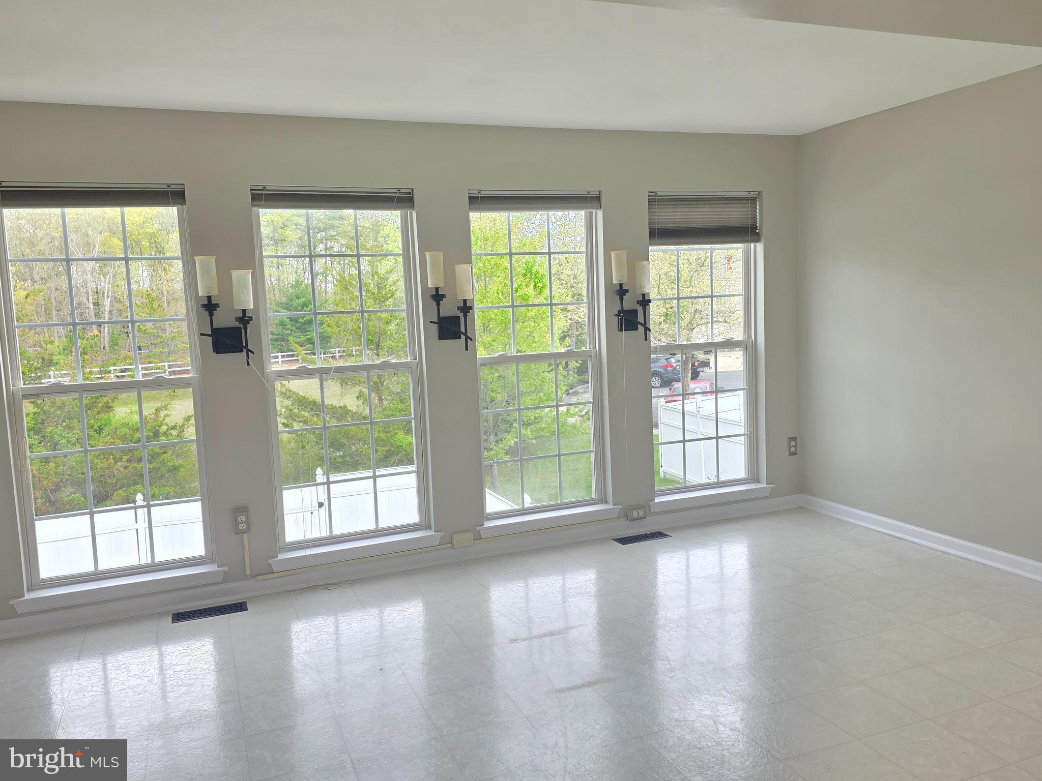 1002 Carlisle Road Egg Harbor Township, NJ 08234 - Photo 26 of 32 a view of an empty room with wooden floor and a window